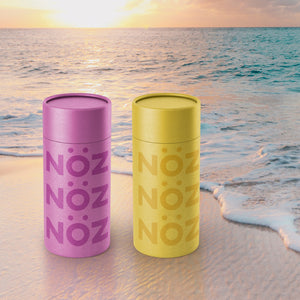 Colorful, affordable and easy to apply SPF sticks on the beach